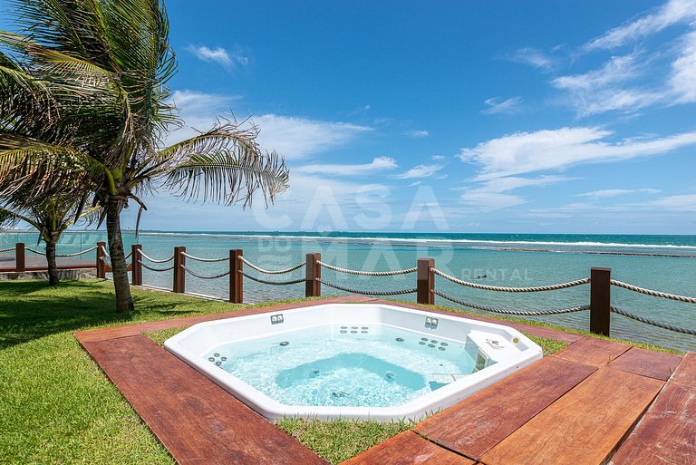 Linda casa com 9 suítes, pé na areia da praia