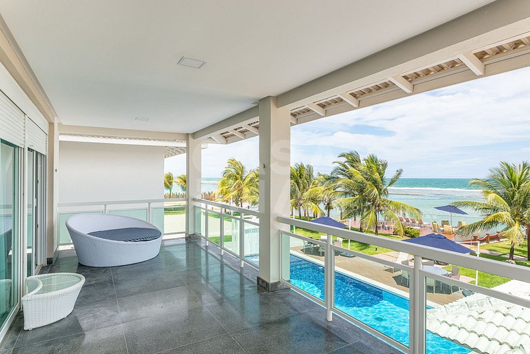Linda casa com 9 suítes, pé na areia da praia